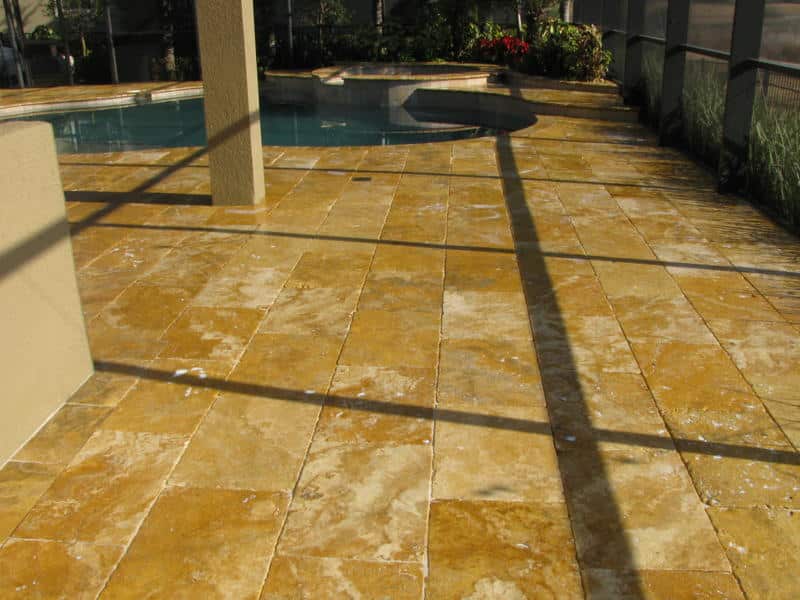 Sealed travertine pool deck, the kind of smooth surface that can become slippery when wet