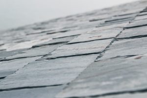 Close-up of stacked thin slate roofing tiles