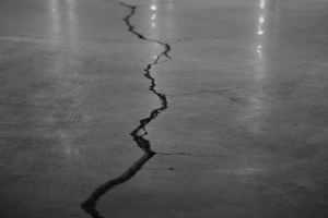 A long crack running across a polished concrete floor