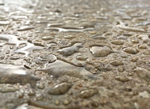 Water beading on a freshly sealed textured surface