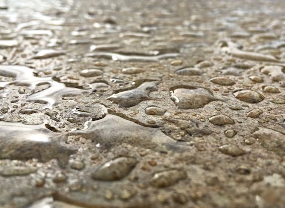 Water beading on a freshly sealed textured surface