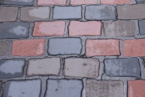Close-up of pink and grey brick pavers