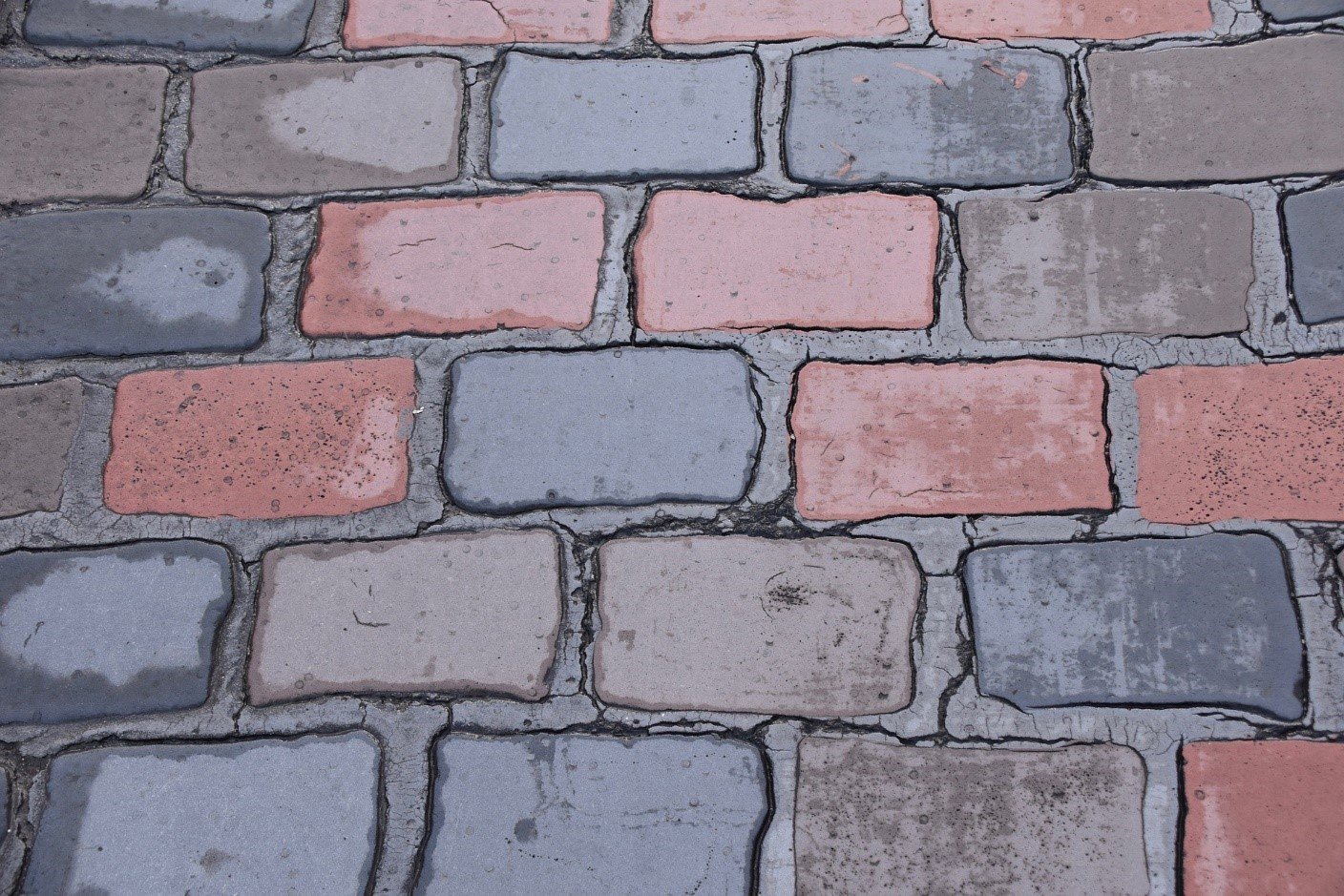 Close-up of pink and grey brick pavers