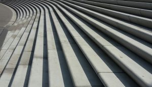 Rows of dark ridged concrete steps receding into the distance