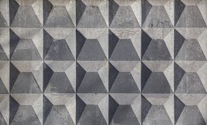 Grey geometric three-dimensional tile panelling