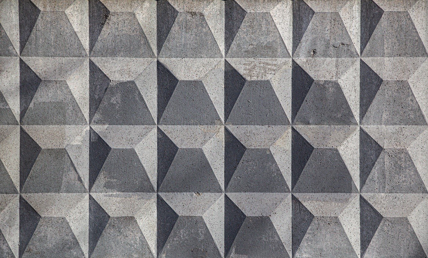 Grey geometric three-dimensional tile panelling