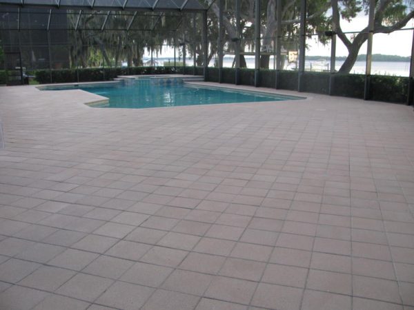 The same screened deck after cleaning and sealing, warm and even