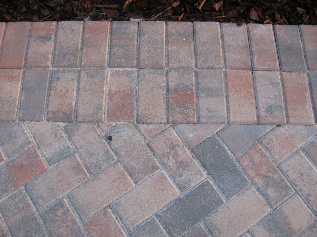 Brick walkway and soldier course border, dry and dusty