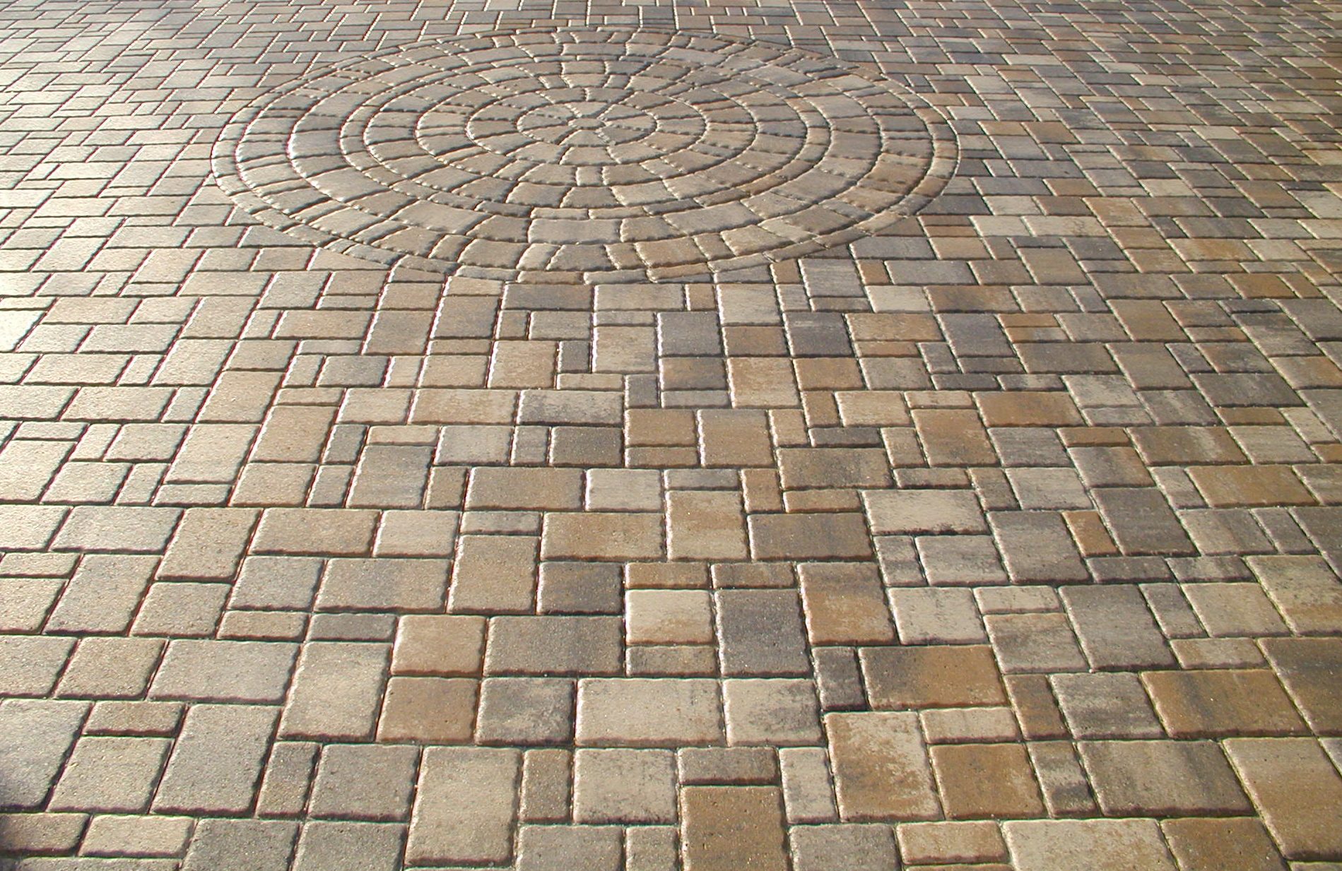 A sealed paver driveway on a completed job