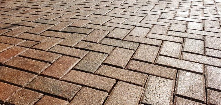 Pavers sealed with Seal n Lock PRO High-Gloss 1K, showing a clear high-gloss finish