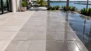 Paver patio showing four sealer finishes side by side, from natural to high gloss